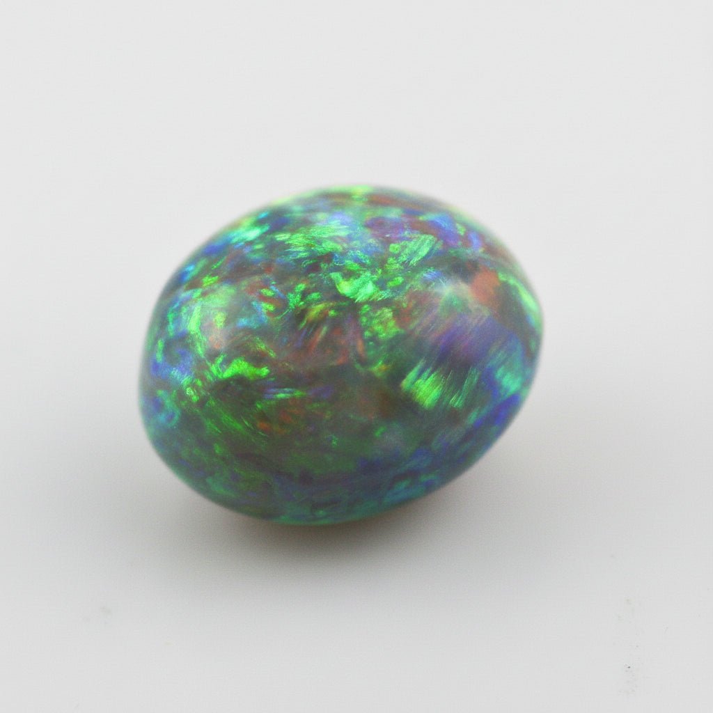 5.38 Carat Australian Dark Opal Cabochon - Orange Green Play of Color - Gemstone Portal