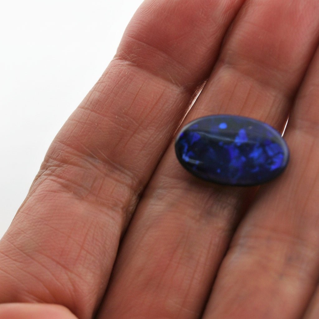 5.44 Carat Black Opal Oval Cabochon - Blue Play of Color - Gemstone Portal