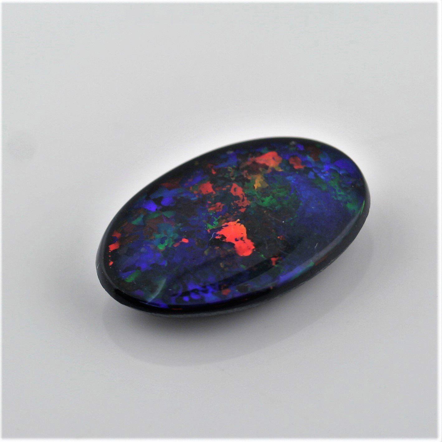 5.82 Carat Black Opal Oval Cabochon - Multi - Color Red Blue Green Fire - Gemstone Portal