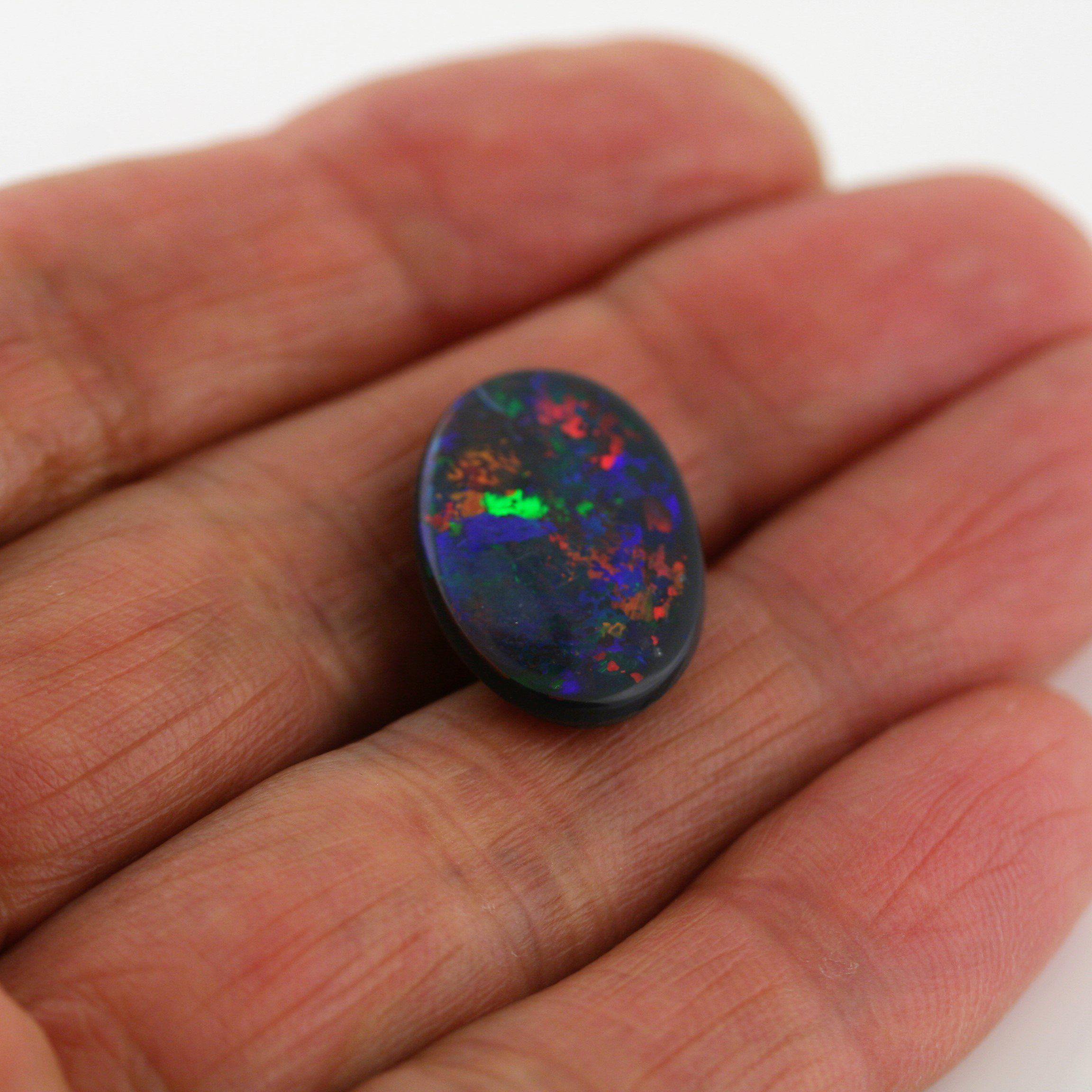 5.82 Carat Black Opal Oval Cabochon - Multi - Color Red Blue Green Fire - Gemstone Portal