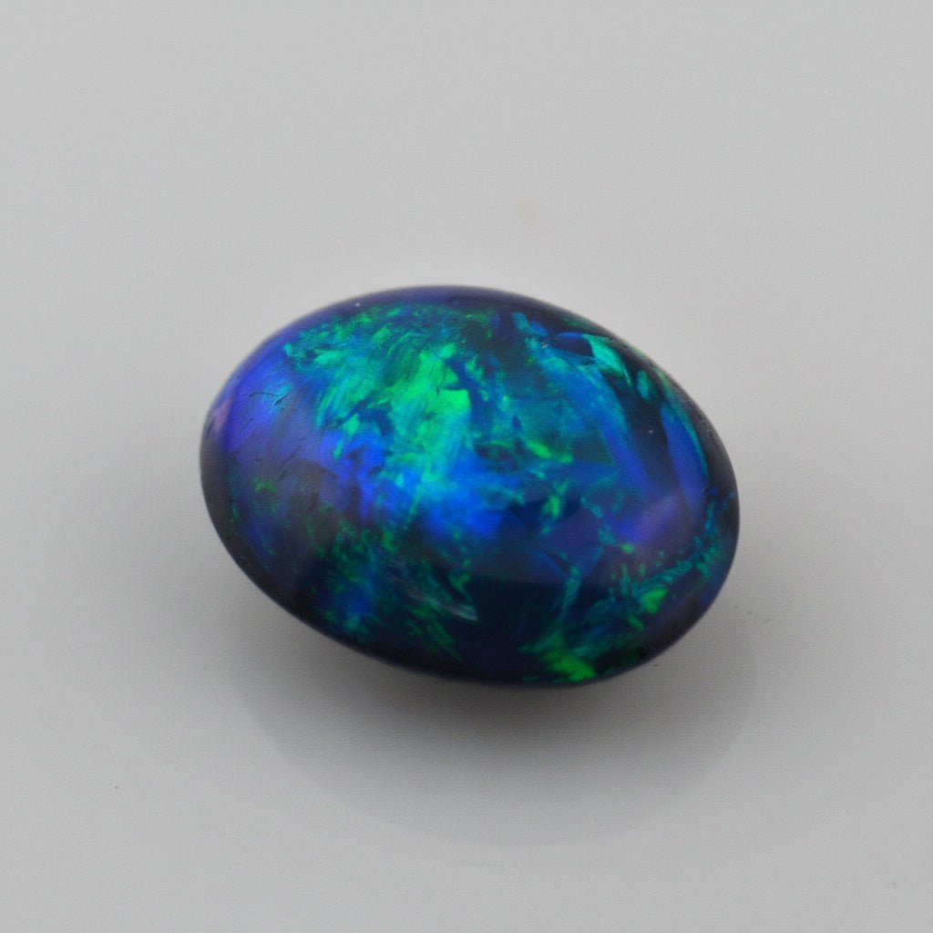 5.49 Carat Black Crystal Opal Oval Cabochon - Green Blue Fire - Gemstone Portal
