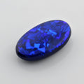5.44 Carat Black Opal Oval Cabochon - Blue Play of Color - Gemstone Portal