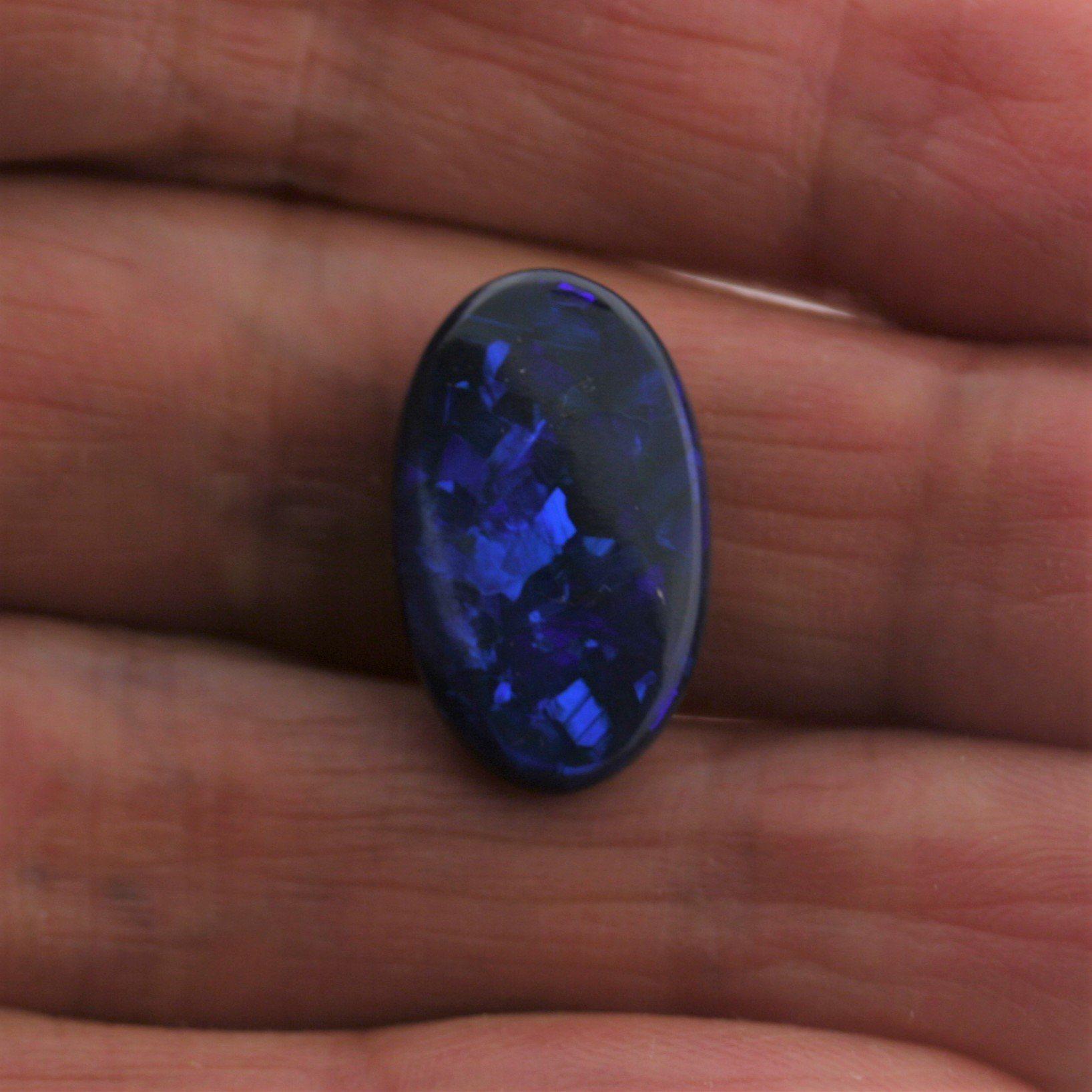 5.44 Carat Black Opal Oval Cabochon - Blue Play of Color - Gemstone Portal
