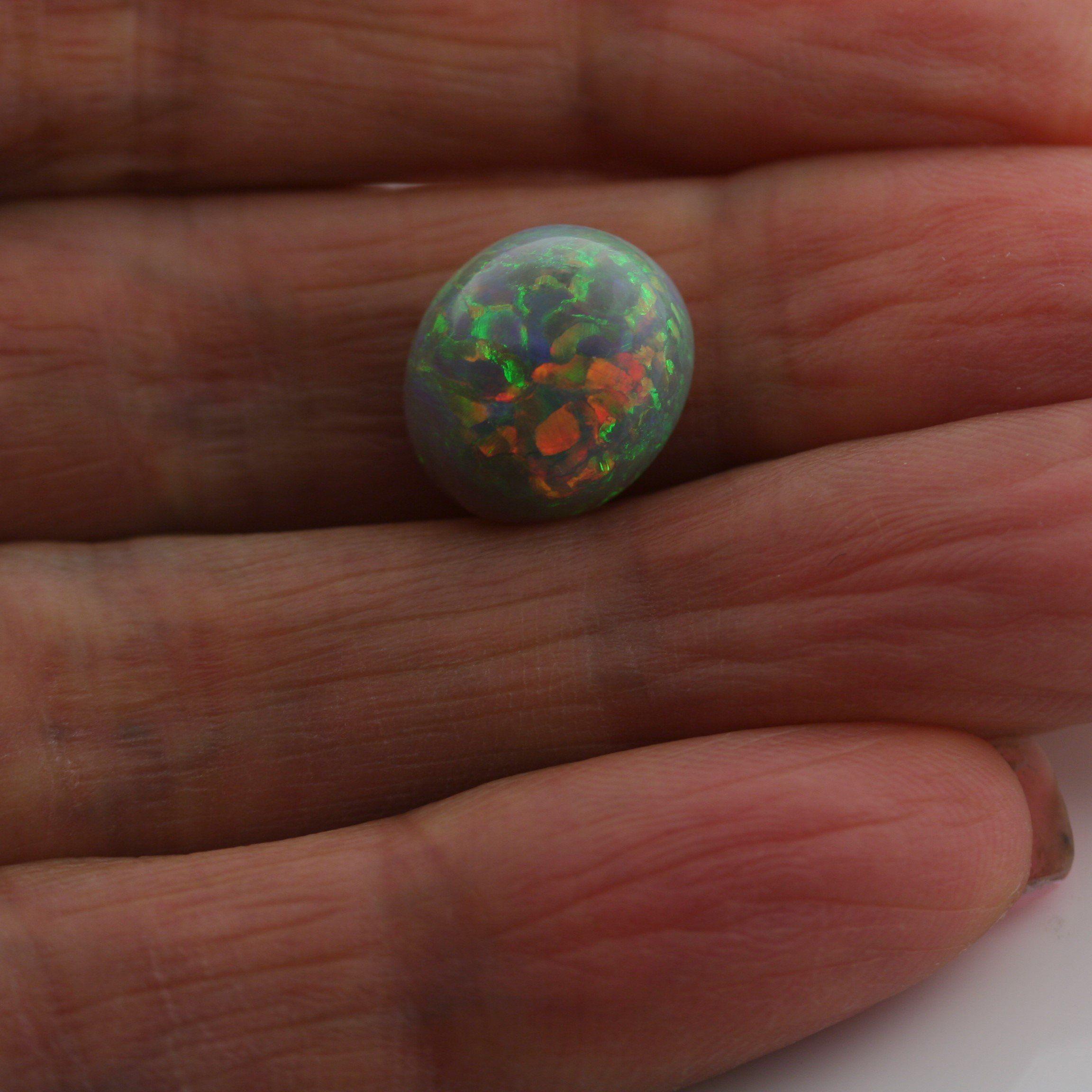 4.67 Carat Dark Opal Cabochon - Green Orange Blue Fire - Gemstone Portal