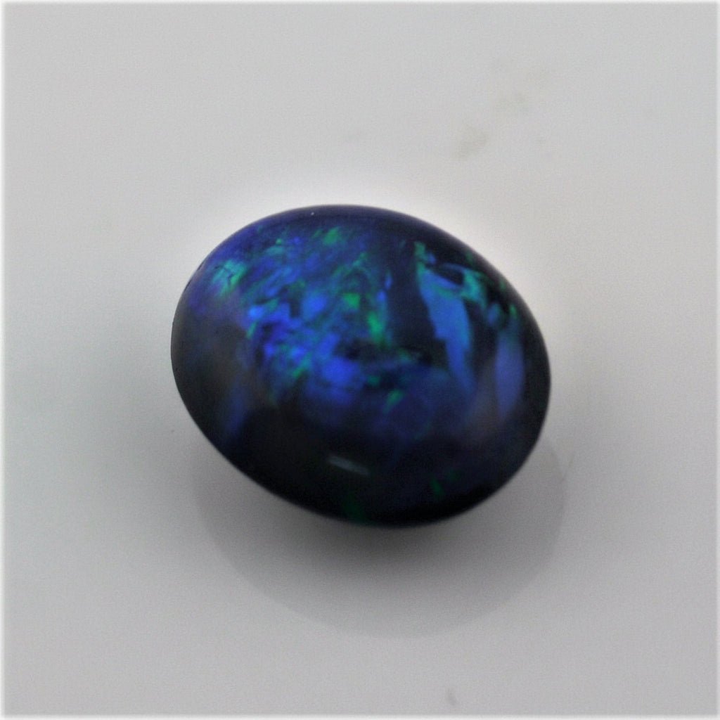 5.49 Carat Black Crystal Opal Oval Cabochon - Green Blue Fire - Gemstone Portal